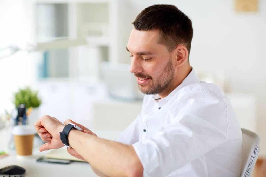 real estate professionals looking at watch