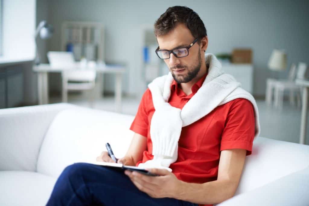 Nebraska notary taking notes in the business journal