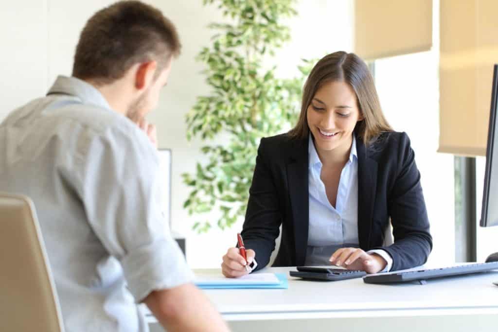 Landlord and property manager reviewing rent guarantee insurance