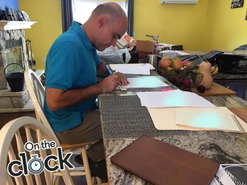 David Vidal, Notary Loan Signing Agent working on loan documents