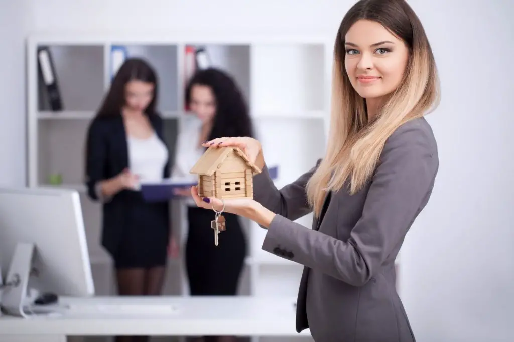 CT real estate agent working in office