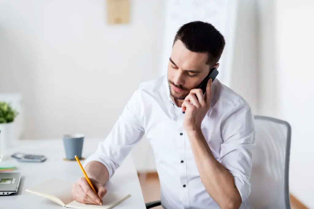 Property manager calling tenants for late payment